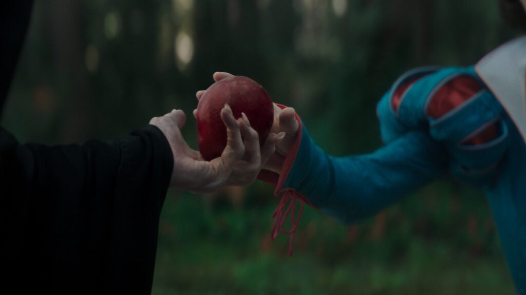 Evil Queen giving Snow White the Apple